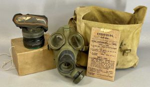 ASSORTED MILITARIA, including WWII canvas knapsack containing gas mask and anti-gas eye shield, with