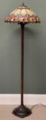 TIFFANY STYLE STANDARD LAMP with metal column, leaded coloured shade, 146cms (h), shade 45cms (