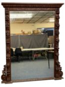 MASSIVE OAK FRAMED OVERMANTEL MIRROR, moulded cornice carved with leaves, surround deeply carved