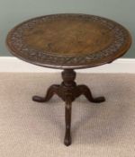 19TH CENTURY OAK TRIPOD TABLE, circular tilt top carved with a band of scrolls within a moulded
