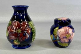 TWO MOORCROFT CERAMICS comprising Clematis vase, 15.5cms (h); and Magnolia ginger jar and cover,