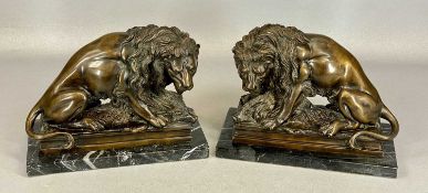PAIR OF BRONZE SEATED LIONS, on marble bases, 23 (h) x 29cms (w) (2) Provenance: private
