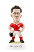 RUGBY UNION CLUB HOUSE: THE WORLD OF GROGGS Dan Lydiate in Welsh kit carrying scrum cap, limited
