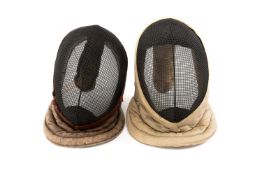 FENCING CLUB HOUSE: TWO VINTAGE MASKS, early 20th Century, one with leather frame and stamped '