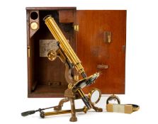 SCIENCE CLUB HOUSE: NEGRETTI & ZAMBRA LACQUERED BRASS MICROSCOPE, with moveable stage, magnifying