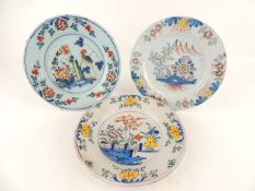 THREE DELFT POLYCHROME PLATES, probably London or Bristol, early 18th Century, 23cm (d)