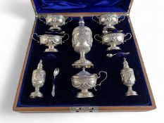 COMPOSED SILVER CONDIMENT SET in the Adams style, comprising large sugar caster by H. Matthews,