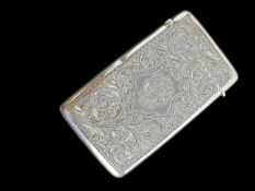 EDWARD VII RECTANGULAR SILVER CARD CASE, engraved with a monogram to central cartouche, scroll