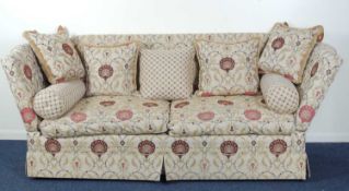 QUALITY KNOLE SETTEE, upholstered throughout in a peacock and foliate patterned fawn ground fabric