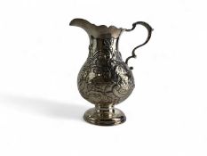 GEORGE II SILVER CREAM JUG, repoussé decorated with farmyard scene and flowers, crested cartouche,