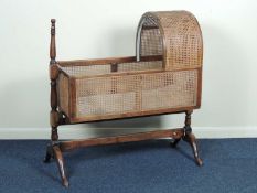 VICTORIAN MAHOGANY & CANED CRIB, on a stand with splayed cabriole legs, 108 (h) x 102cms (w)