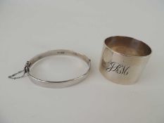 HEAVY SILVER NAPKIN RING, London 1943, 48g, also a SILVER ENGRAVED HINGED BANGLE, 18g (2)