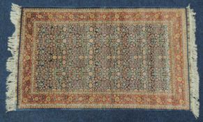 IRANIAN HERATI SILK RUG, late 20th Century, blue field with palmette border, signed, 158 x 94cms
