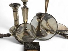 TWO SILVER HANDLED LOOKING GLASSES (marks rubbed) also a silver backed hand mirror, Birmingham 1906;