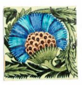 WILLIAM DE MORGAN (1839-1917) DECORATED CERAMIC TILE, detailed with a Persian carnation in blues and
