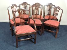 SET OF SEVEN GEORGE III STYLE MAHOGANY DINING CHAIRS, with arched top rails, pierced splat backs,