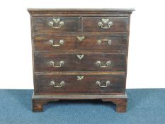 GEORGE III OAK CHEST OF DRAWERS, circa 1780-1800, brass swan neck drop handles, brass escutcheons,