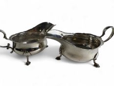 MATCHED PAIR OF EDWARD VII SILVER SAUCEBOATS, with shaped loop handles, on three pad feet, Martin