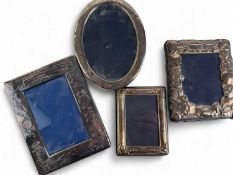 FOUR MODERN SILVER PHOTOGRAPH FRAMES, including two nursery frames, aperture 11.5 x 7.5cms and 9 x