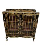 CHINOISERIE BLACK LACQUERED DOUBLE BOW FRONT DISPLAY CABINET, early 20th Century, 122cm (w),