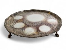 GEORGE VI CIRCULAR SILVER SALVER, shaped moulded gadrooned border, on four claw and ball feet,