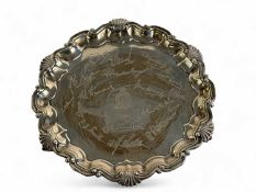 EDWARD VII CIRCULAR SILVER CARD TRAY, shaped shell moulded border, on three claw and ball feet,