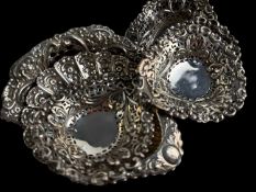FOUR SILVER HEART SHAPED PIERCED BONBON DISHES, Birmingham 1897/8, 9cm (d), 70g, also another SILVER