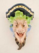ITALIAN MAIOLICA BACCHANALIAN MASK WALL BRACKET, crowned Naples mark to reverse, 24cms (h)