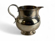 GEORGE V SILVER BELLIED JUG with reeded loop handle, D & J Wellby Ltd, London 1924, 15cms (h),