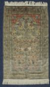 FINE KASHAN SILK WALL RUG, late 20th Century, fawn field with floral vases and peacocks within a
