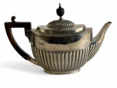 VICTORIAN OVAL SILVER TEAPOT with gadrooned decoration, ebonised handle and finial, William Hutton &