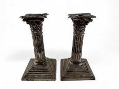 PAIR OF EDWARDIAN SILVER CORINTHIAN COLUMN DWARF CANDLESTICKS, London 1901 (loaded), 16cm (h)