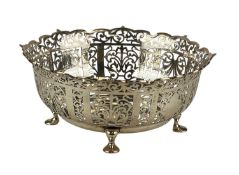 GEORGE V CIRCULAR SILVER BOWL with shaped pierced sides, on four pad feet, Russells Ltd, London
