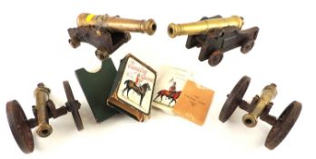 FOUR MINIATURE CANNONS, model of 18th century English naval cannon on wooden carriage, 20cms (l),