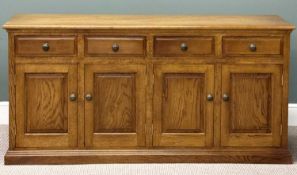 REPRODUCTION OAK DRESSER BASE, four drawers over four cupboards, with brass knob handles, 84 (h) x