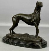 AFTER MÊNE: BRONZE STATUE OF A STANDING GREYHOUND, on oval stepped black marble base, 21cms (h)
