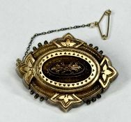 VICTORIAN GOLD MOURNING BROOCH with glass back, safety chain, marked '10ct', 45 x 35mms, 9g
