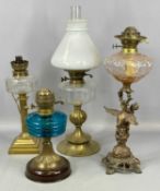 FOUR OIL LAMPS, cast metal with figural column, moulded glass shade and twin burners, 51cms (h);
