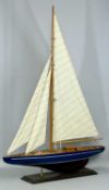 MODEL YACHT, burgundy keel, blue hull with white stripe, single mast with three sails, on painted