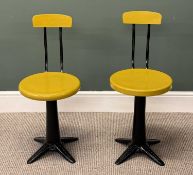 TWO CAST IRON SINGER SEWING MACHINE CHAIRS, with circular painted seats and back rests, adjustable