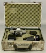 PRAKTICA MTL5 SLR CAMERA, with three lenses and flash, in padded aluminium case Provenance: