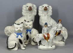 19TH CENTURY STAFFORDSHIRE - PAIR OF SEATED CATS, with open front legs, cream and black glazed