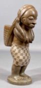 AFRICAN GABON SOAPSTONE CARVING of a lady with basket, signed 'Wanza' on base, 24cms (h) Provenance: