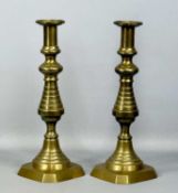 PAIR OF LARGE 19TH CENTURY BRASS CANDLESTICKS with knopped columns and octagonal bases, 36cms (h)