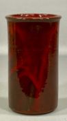 DONIAU CUDD, BANGOR STUDIO TERRACOTTA VASE, cylindrical with a red glaze, manufacturer's label to