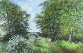 ‡ PAUL WESTON oil on card - untitled landscape, wooded area and stone bridge, signed, 34 x 53cms