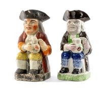 TWO 19TH CENTURY POTTERY TOBY JUGS, one decorated in Pratt colours, other in pearlware glaze, both