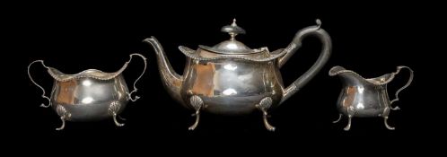 GEORGE V SILVER THREE PIECE TEA SET, Birmingham 1911, raised on shell capped legs, gadrooned rims,