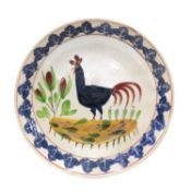 LARGE LLANELLY POTTERY 'COCKEREL' BOWL, naively decorated by Sarah Roberts with plants and blue