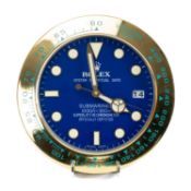 ROLEX-STYLE WALL CLOCK, modelled as a 'Submariner' with blue watch dial, electric movement, 34cms (